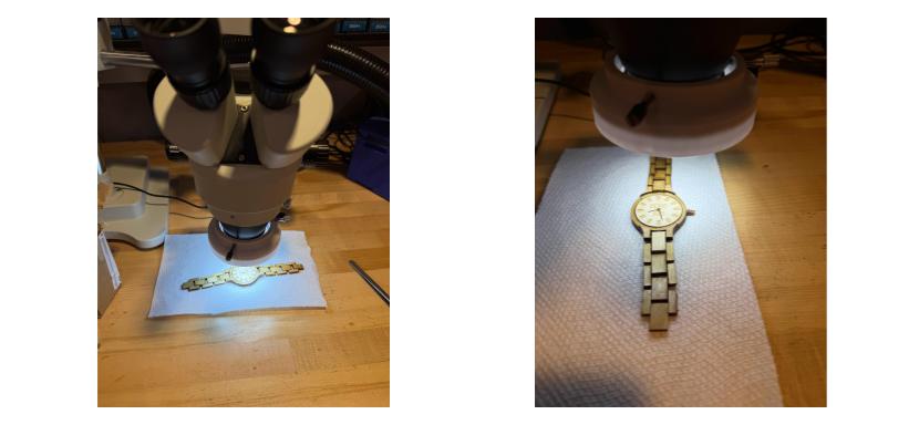 Using a microscope to attach the watch hands